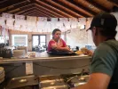 Marisela Godinez, owner of El Mesón Tequilería in Austin, Texas, used to send far more leftover food to the landfill.Credit...
